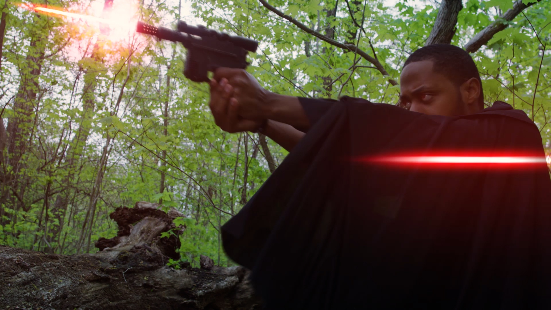 Man shooting a Star Wars blaster